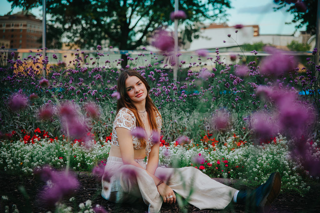 girl sitting in flowers grand rapids michigan