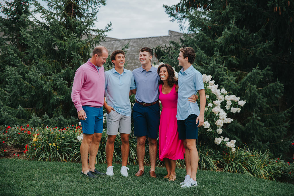 family well dressed golf club smiling